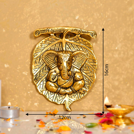 Metal Golden Lord Ganesha on Leaf Wall Hanging Sculpture Decorative Religious Showpiece for Home Wall Decor Pooja Room Temple & House Warming Gifts