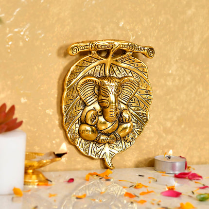 Metal Golden Lord Ganesha on Leaf Wall Hanging Sculpture Decorative Religious Showpiece for Home Wall Decor Pooja Room Temple & House Warming Gifts